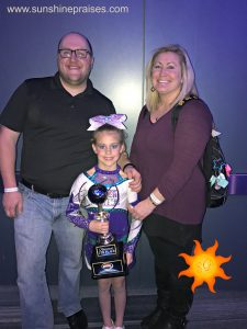 My daughter with her cheer coaches.